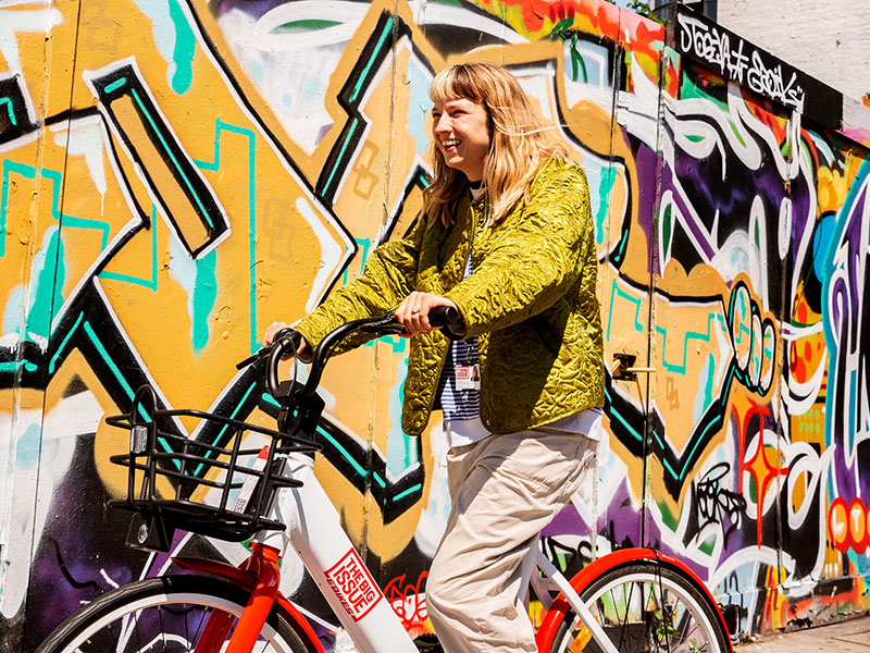 Big Issue staff member on Big Issue electric bike